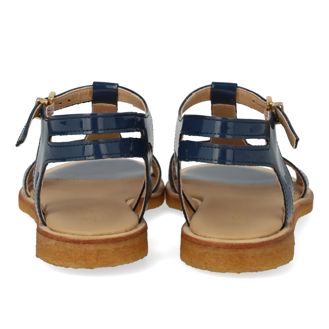 Feminine sandal with strap design