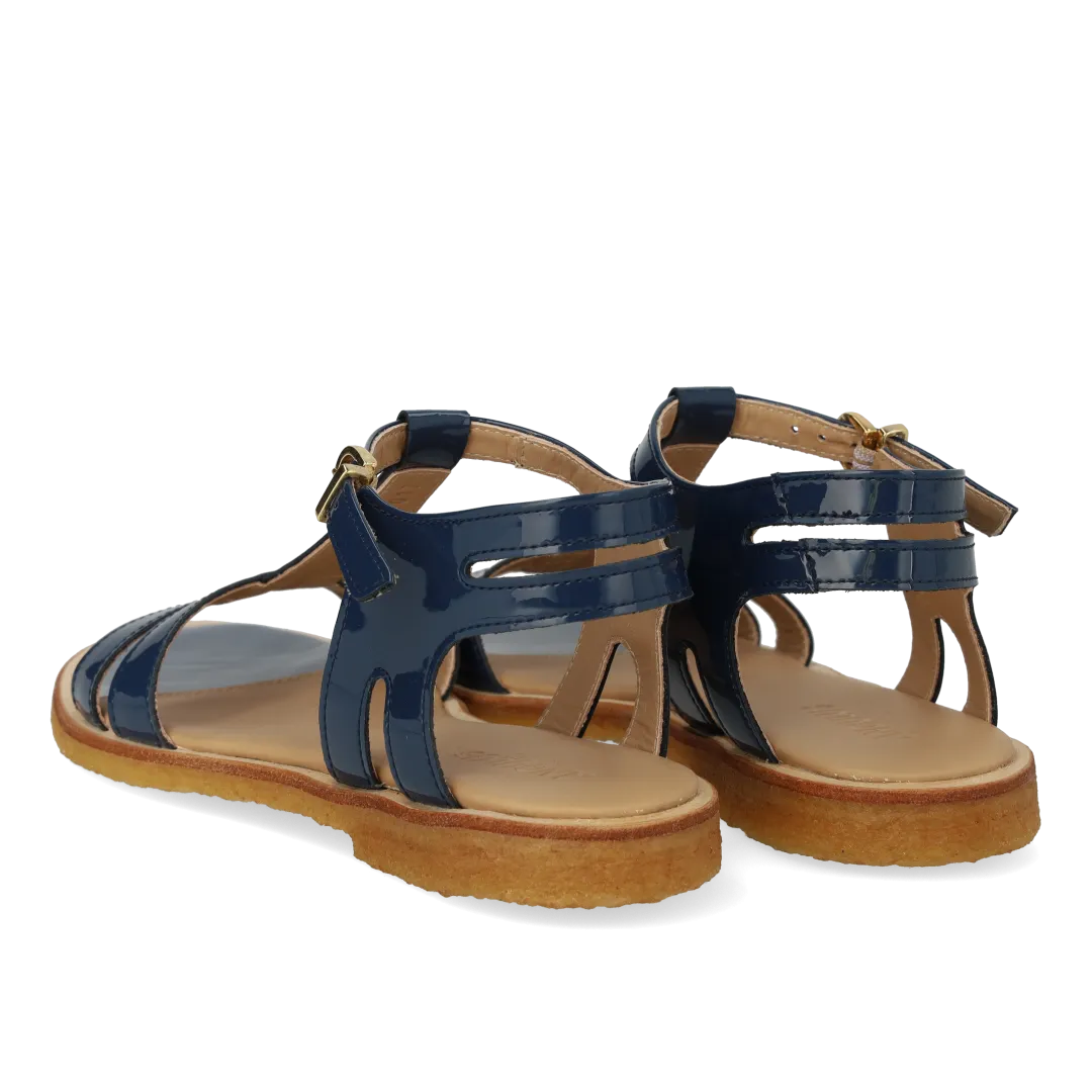 Feminine sandal with strap design